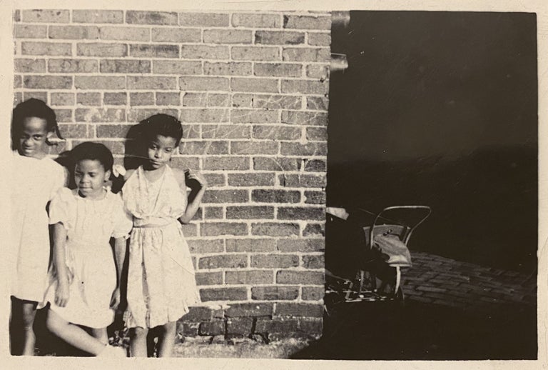 Item #3870 [AFRICAN-AMERICANA - VERNACULAR PHOTOGRAPHS]. Small collection of 7 original photographs of African-Americans (six were taken in the street, the other on a hard-scrabble beach). Anonymous Photographer.