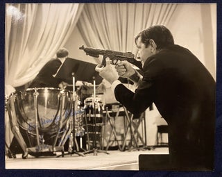 Item #4001 [JOHN CAGE]. Signed photograph of John Cage with Toy Machine Gun. John Cage / Jim...