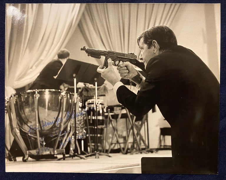 Item #4001 [JOHN CAGE]. Signed photograph of John Cage with Toy Machine Gun. John Cage / Jim Tuttle, subject, photographer.